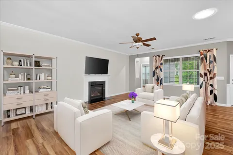 a bedroom with a large bed and a potted plant