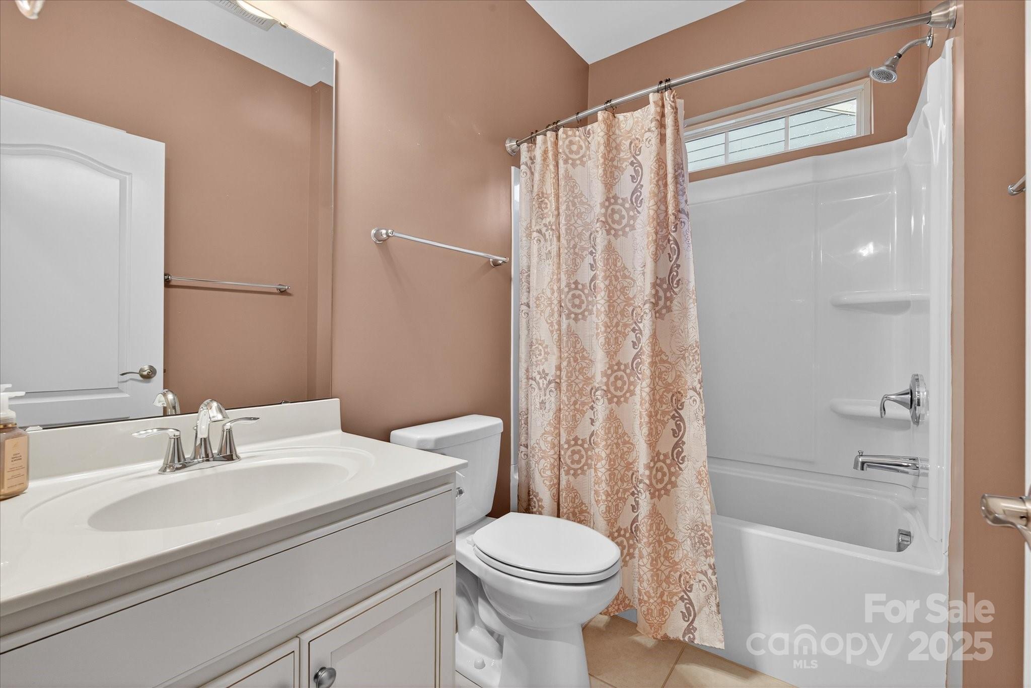 4057 Channel Islands Way Lancaster, SC 29720 - Photo 17 of 34 a bathroom with a sink toilet and shower