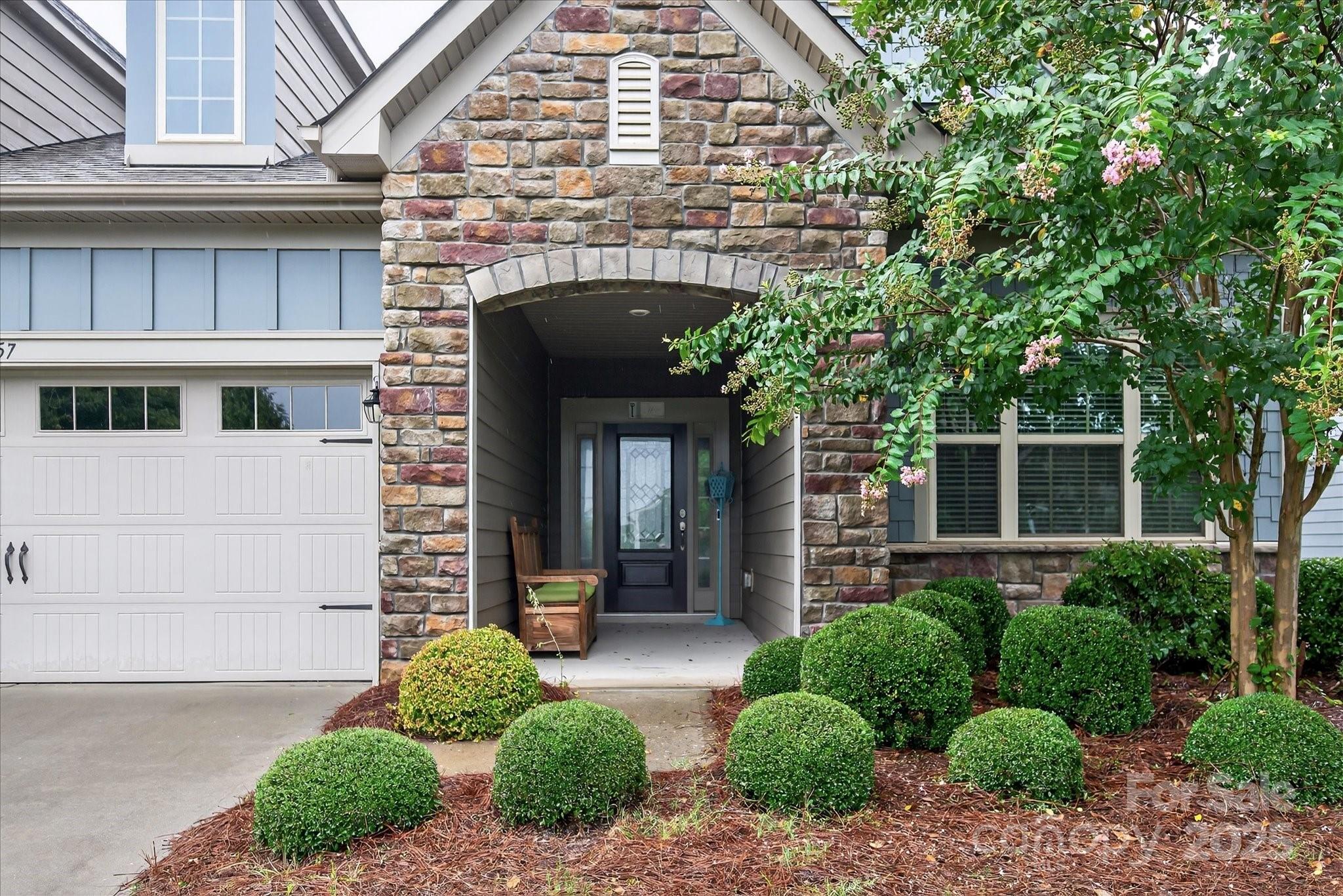 4057 Channel Islands Way Lancaster, SC 29720 - Photo 2 of 34 a front view of a house with garden
