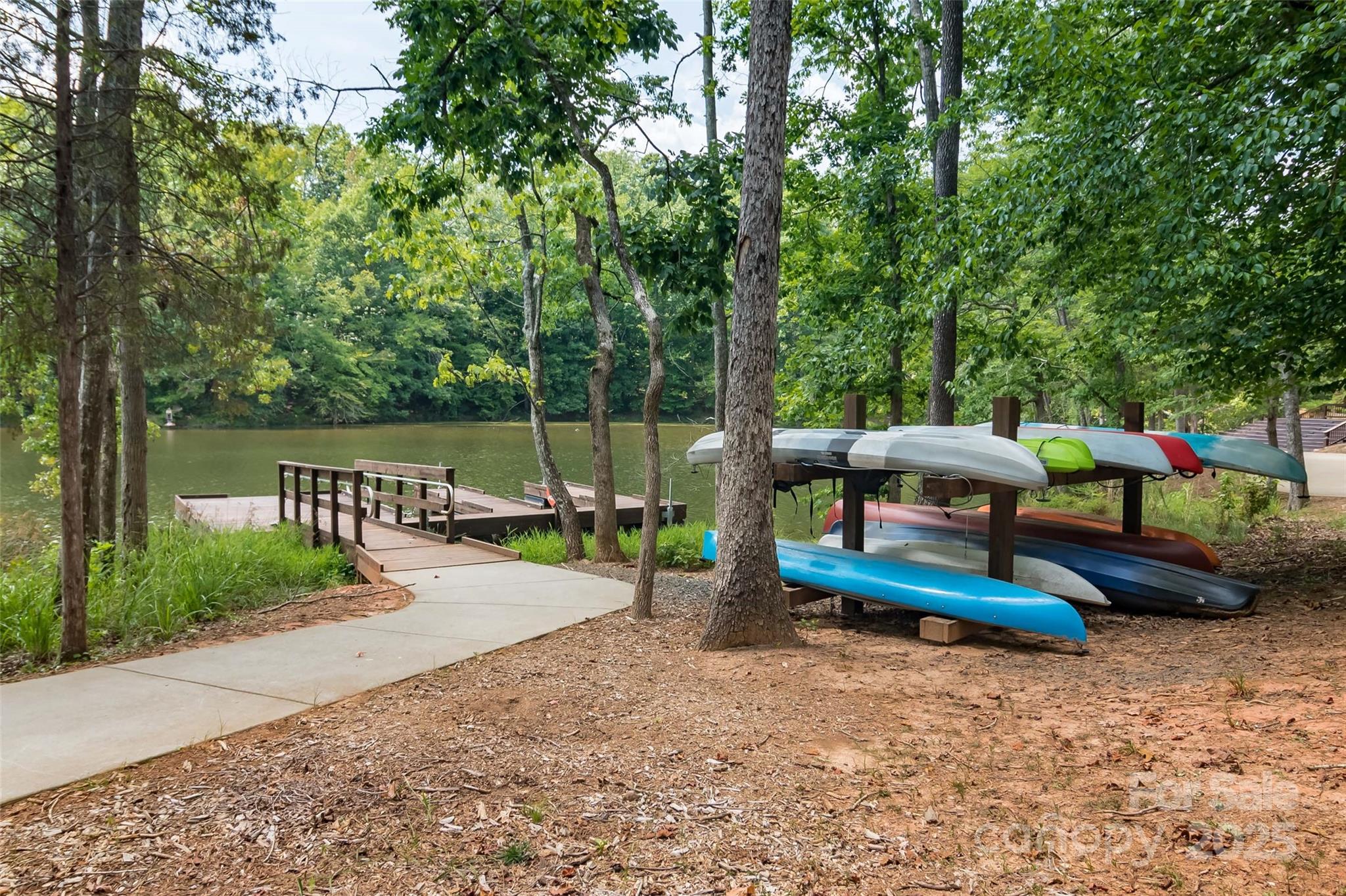 4057 Channel Islands Way Lancaster, SC 29720 - Photo 28 of 34 a view of a park with large trees and a barn