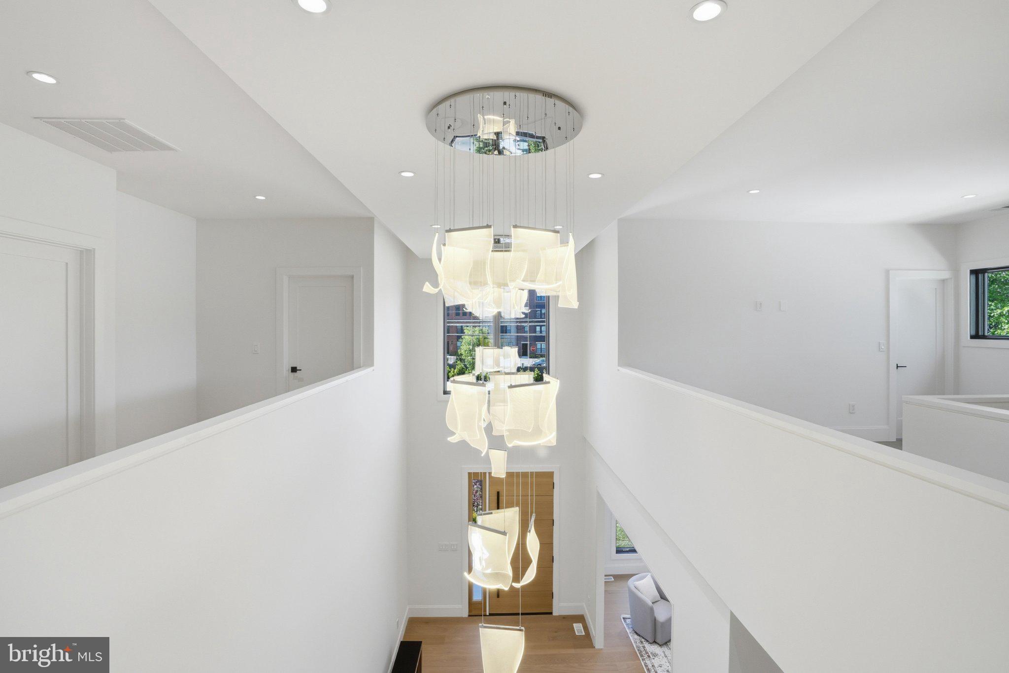 7421 Magarity Road Falls Church, VA 22043 - Photo 39 of 66 Elegant foyer with modern lighting.