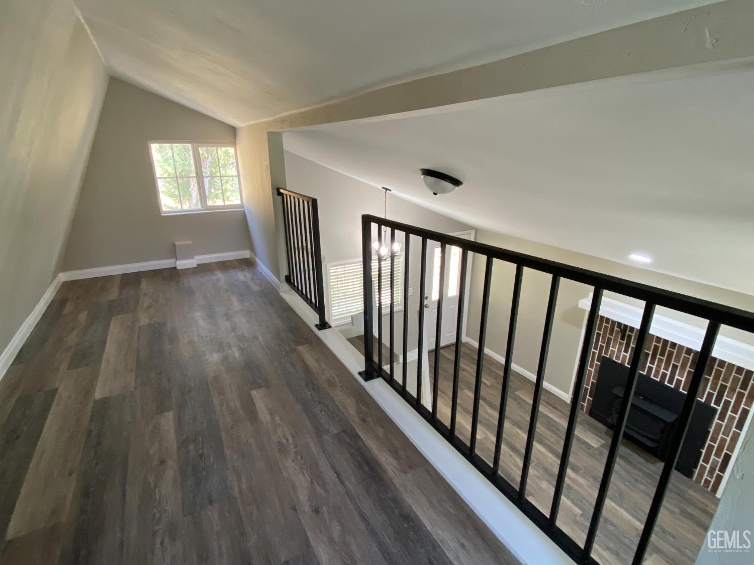 Undisclosed Address Caliente, CA 93518 - Photo 22 of 33 a view of hallway with wooden floor and stairs