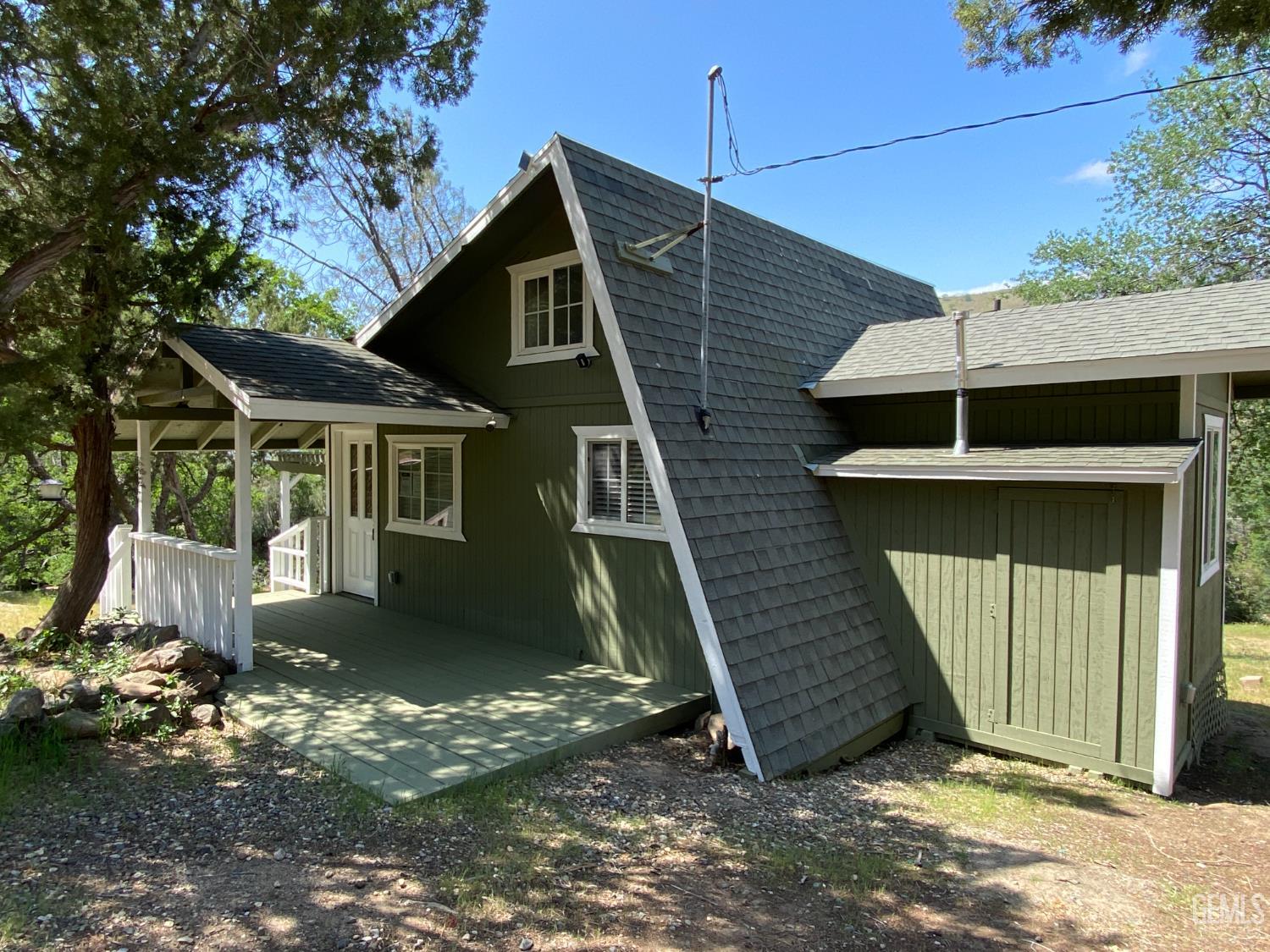 Undisclosed Address Caliente, CA 93518 - Photo 4 of 33 a front view of a house with a garage