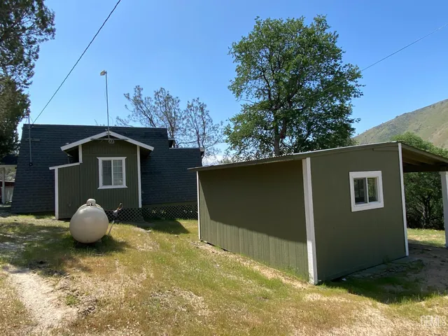 a house with trees in the background