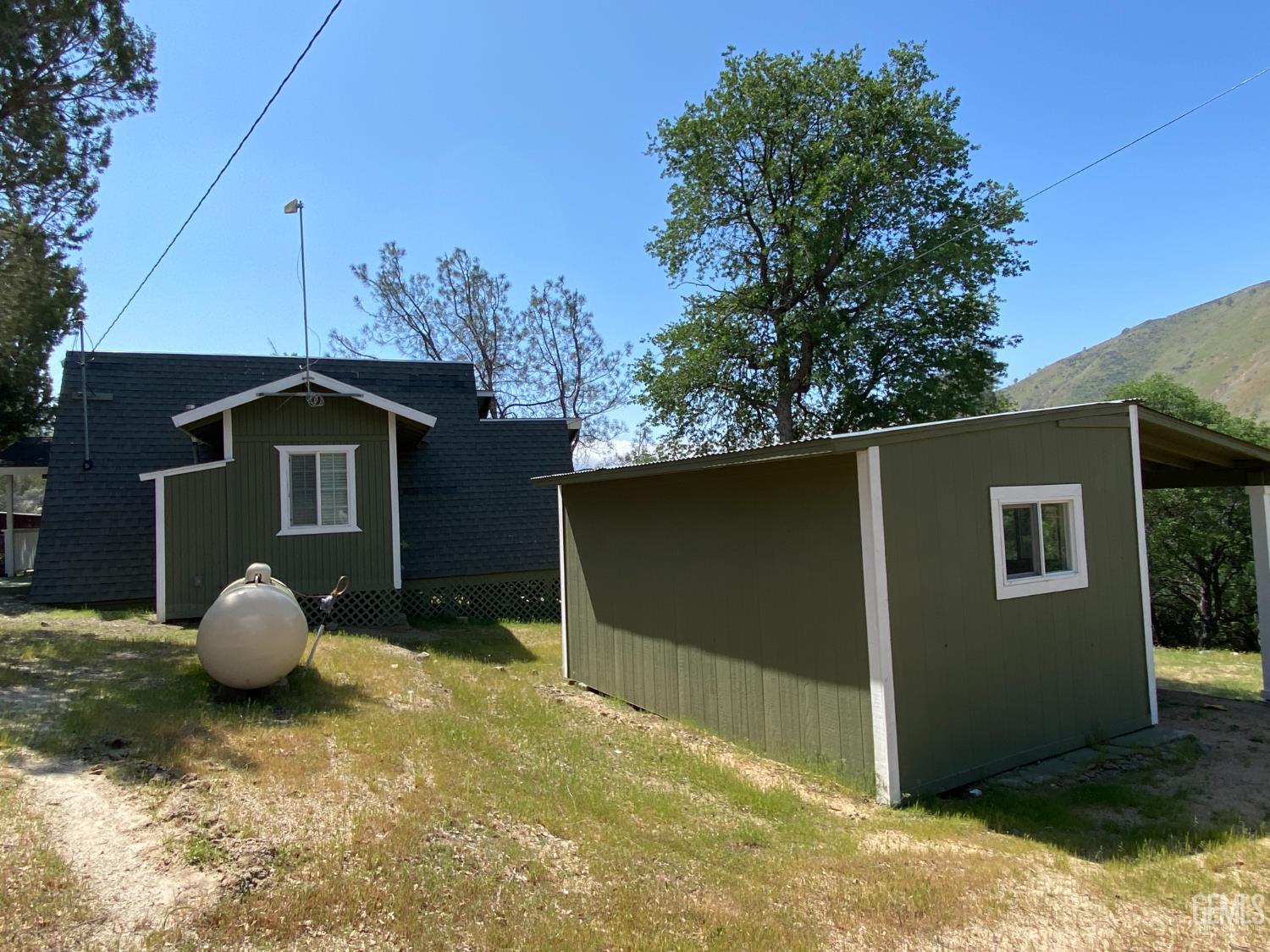Undisclosed Address Caliente, CA 93518 - Photo 7 of 33 a house with trees in the background