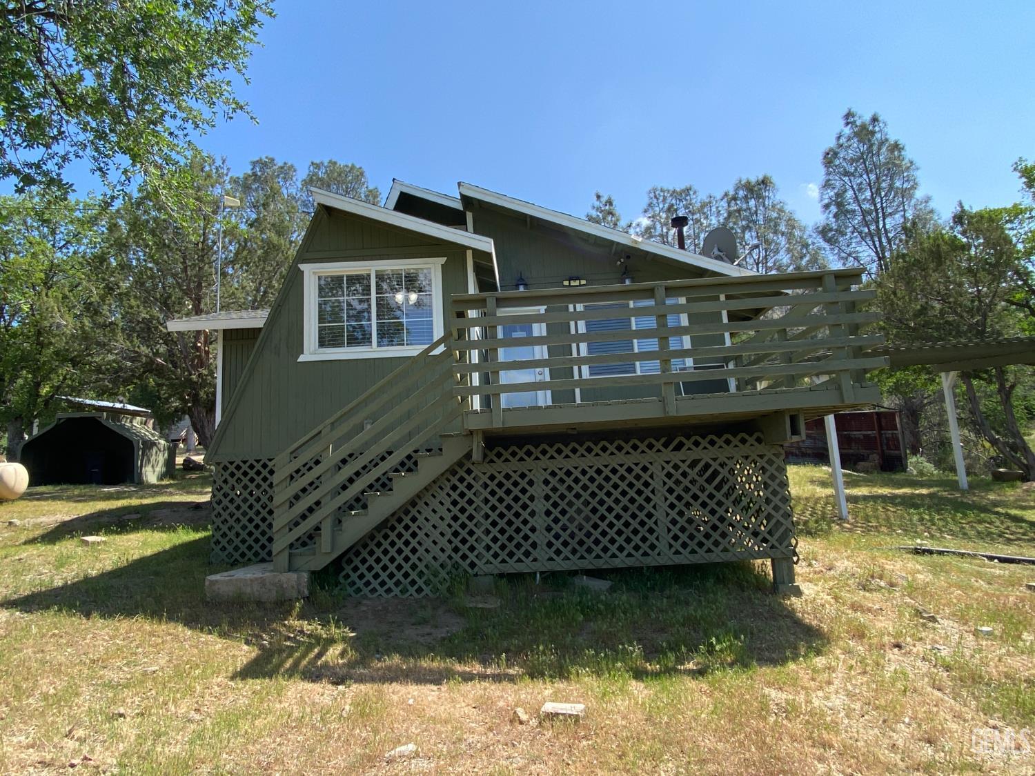 Undisclosed Address Caliente, CA 93518 - Photo 9 of 33 a front view of a house with a yard