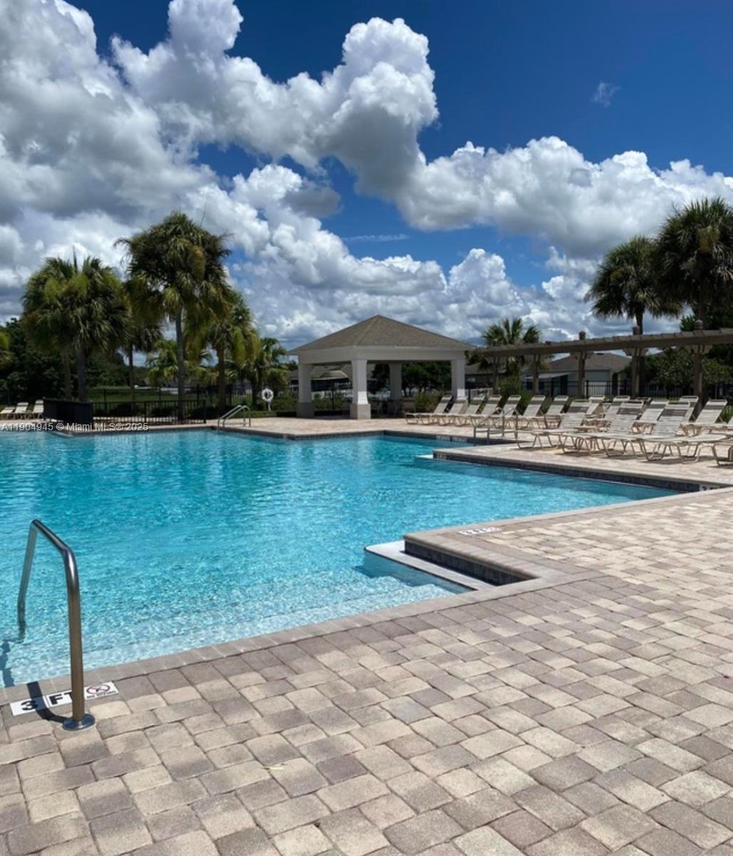15718 Stone House Drive Spring Hill, FL 34604 - Photo 4 of 10 a view of a lake with houses