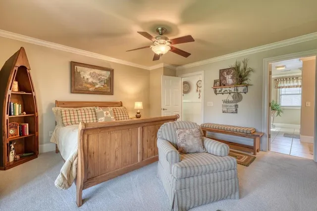 a bed room with a bed and a television