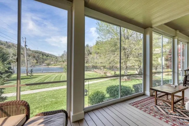 an aerial view of a house with swimming pool and outdoor space