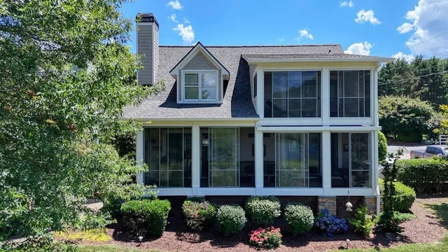 a view of a lake with houses in the back