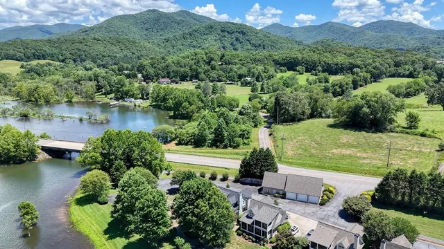a view of a swimming pool with a lake view