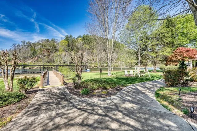 a spacious bedroom with a bed and a chandelier