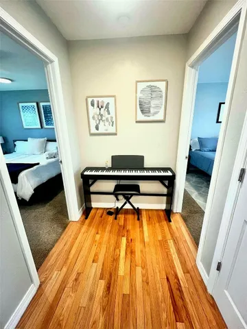 a living room with a bed and furniture