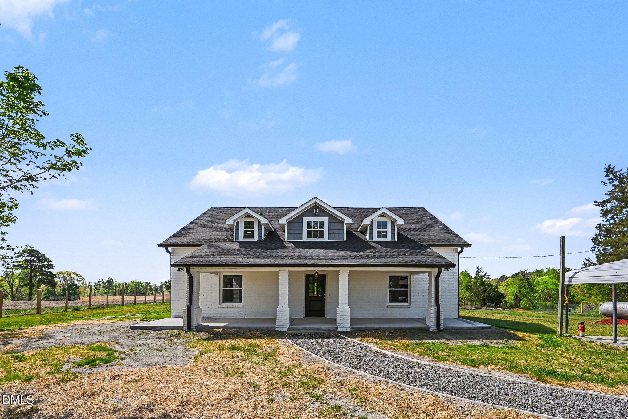 1325 Charlie Carr Road Roxboro, NC 27574 - Photo 2 of 31 front view of a house with a yard