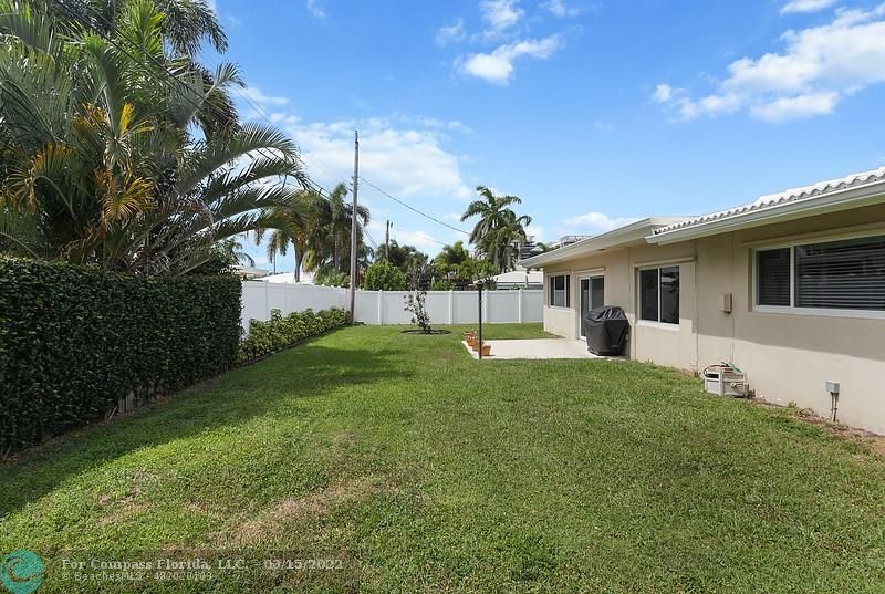 1948 Sailfish Place Lauderdale-by-the-Sea, FL 33062 - Photo 21 of 33 a view of a house with backyard and sitting area