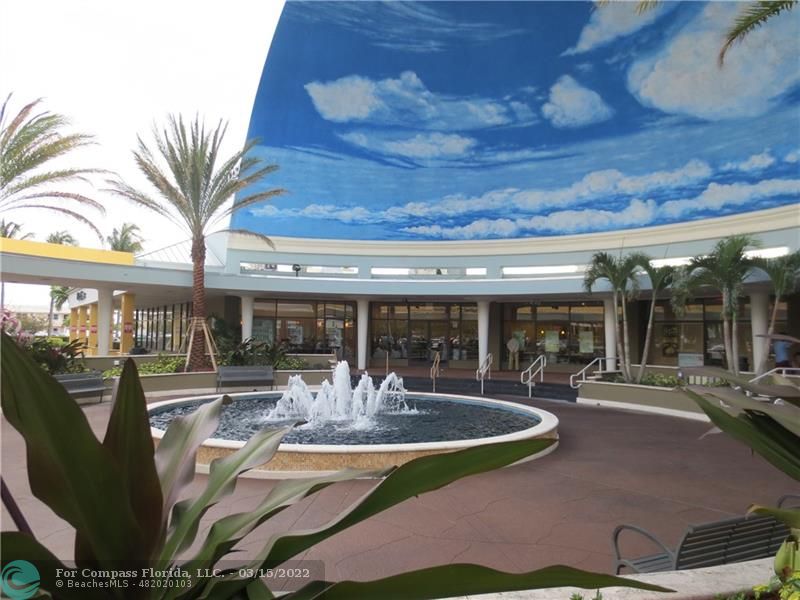 1948 Sailfish Place Lauderdale-by-the-Sea, FL 33062 - Photo 29 of 33 a view of a patio with table and chairs potted plants and large tree