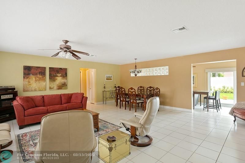 1948 Sailfish Place Lauderdale-by-the-Sea, FL 33062 - Photo 8 of 33 a living room with furniture and a large window