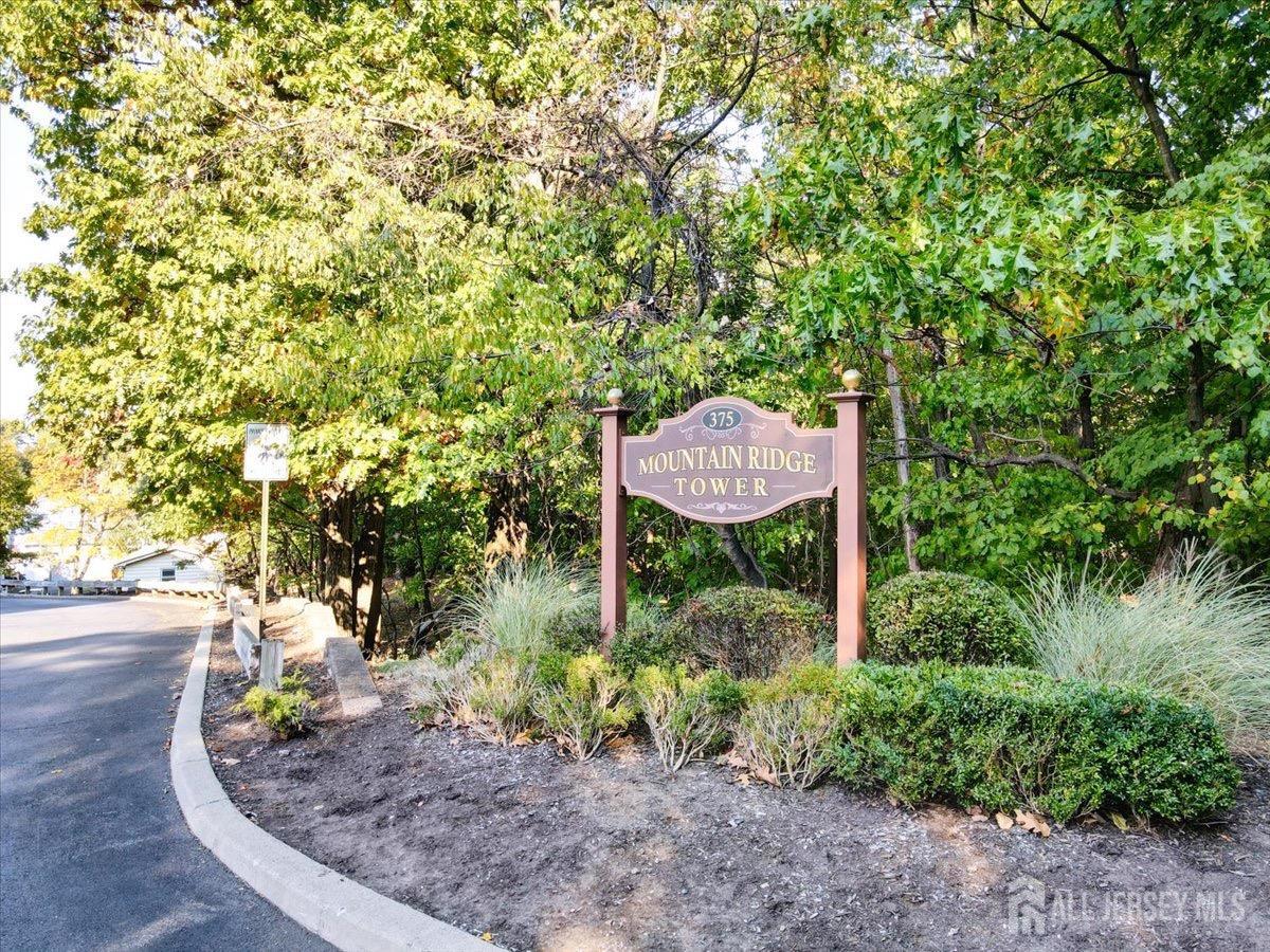 375 Rifle Camp Road, Unit 409 Woodland Park, NJ 07424 - Photo 3 of 22 a view of a garden with plants