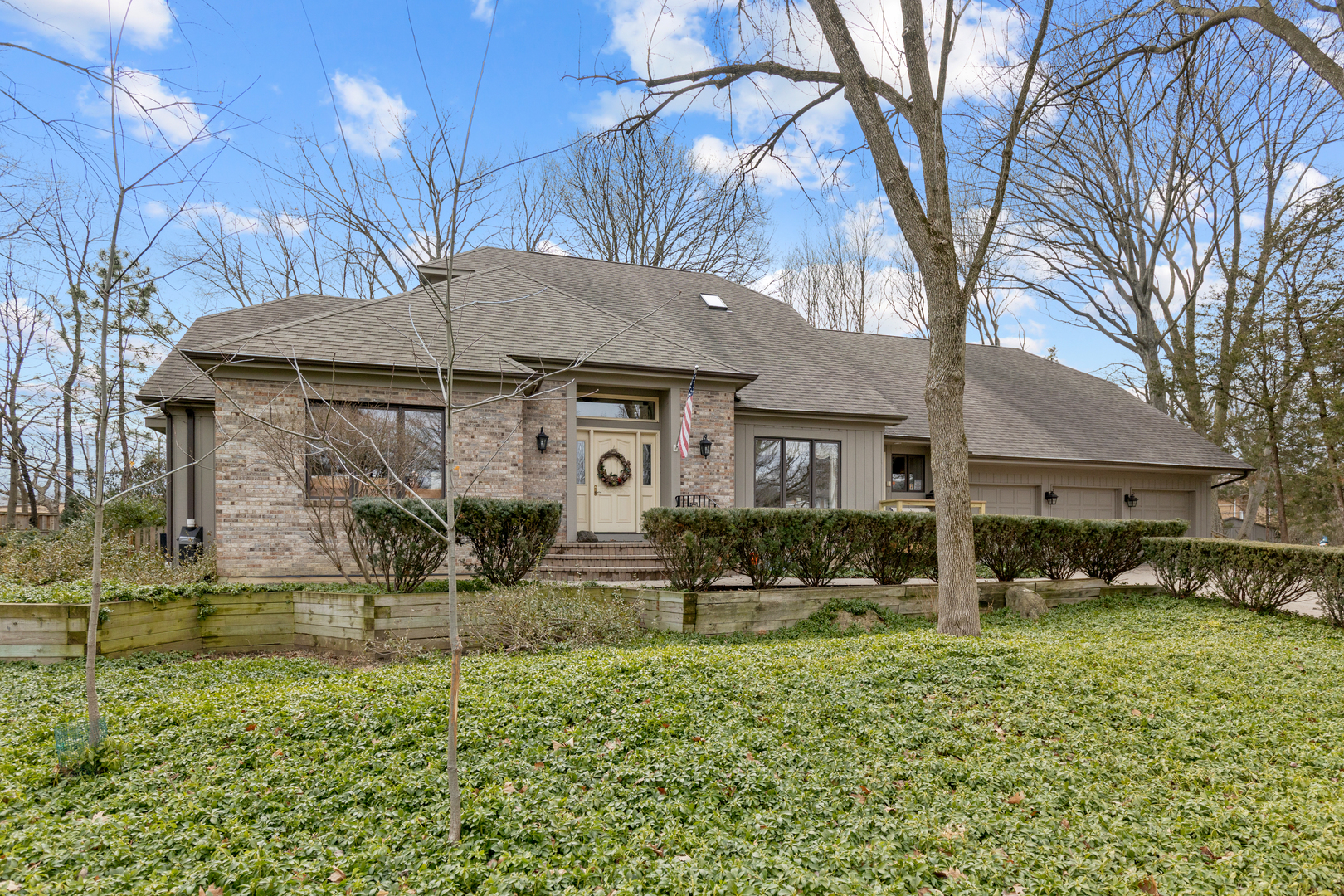 a house that has a tree in front of it