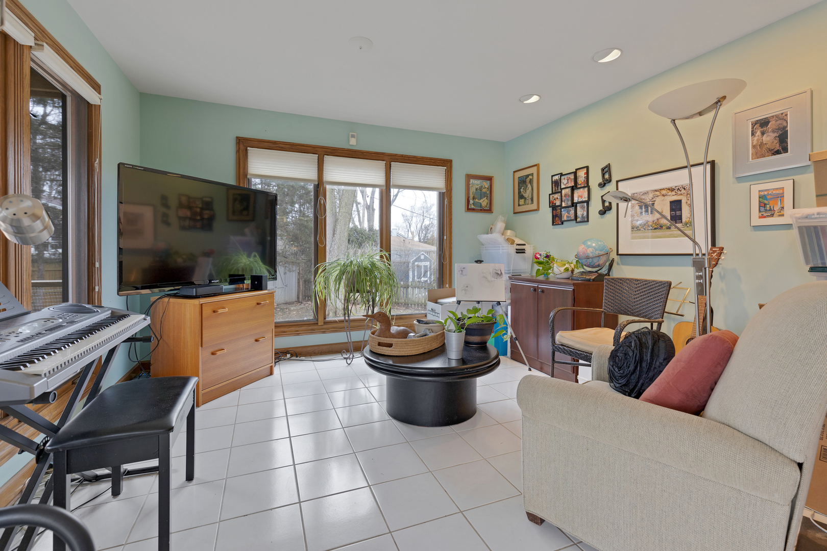 1133 Edgewater Drive Naperville, IL 60540 - Photo 13 of 37 a living room with furniture and a flat screen tv