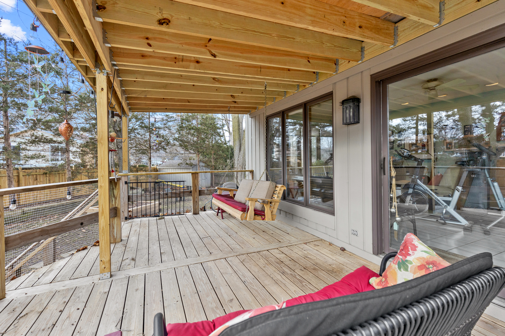 1133 Edgewater Drive Naperville, IL 60540 - Photo 27 of 37 a living room with furniture and a floor to ceiling window