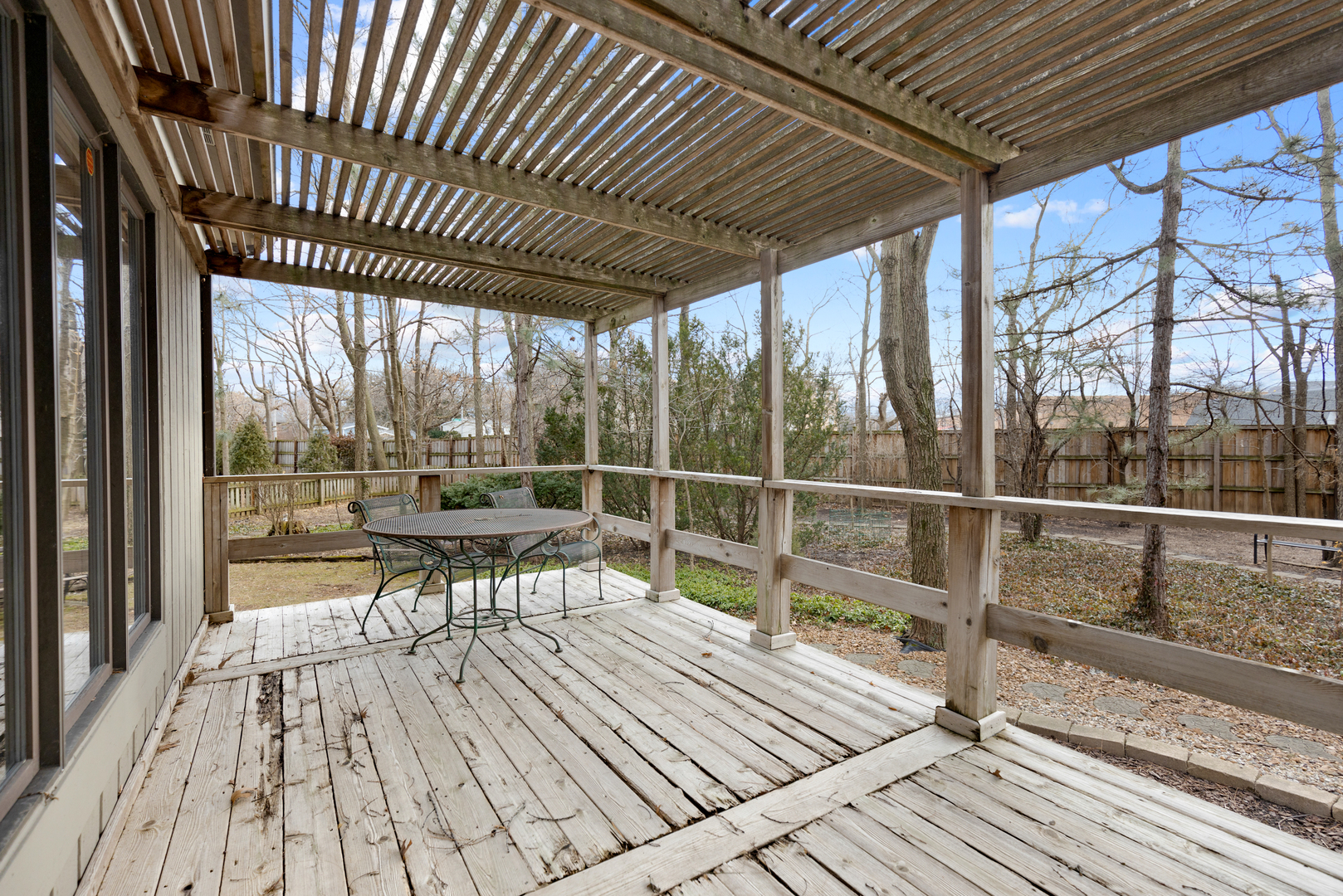 1133 Edgewater Drive Naperville, IL 60540 - Photo 28 of 37 a view of a balcony with wooden floor and iron stairs