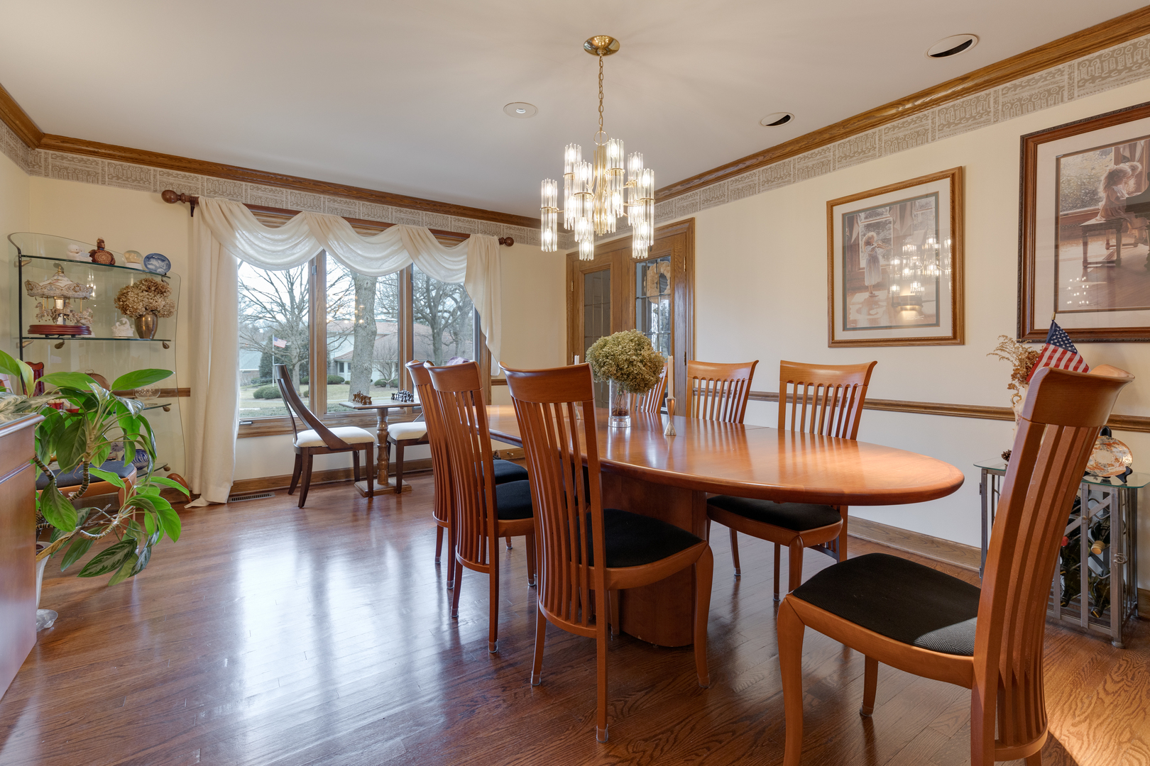 1133 Edgewater Drive Naperville, IL 60540 - Photo 7 of 37 a view of a dining room with furniture window and wooden floor