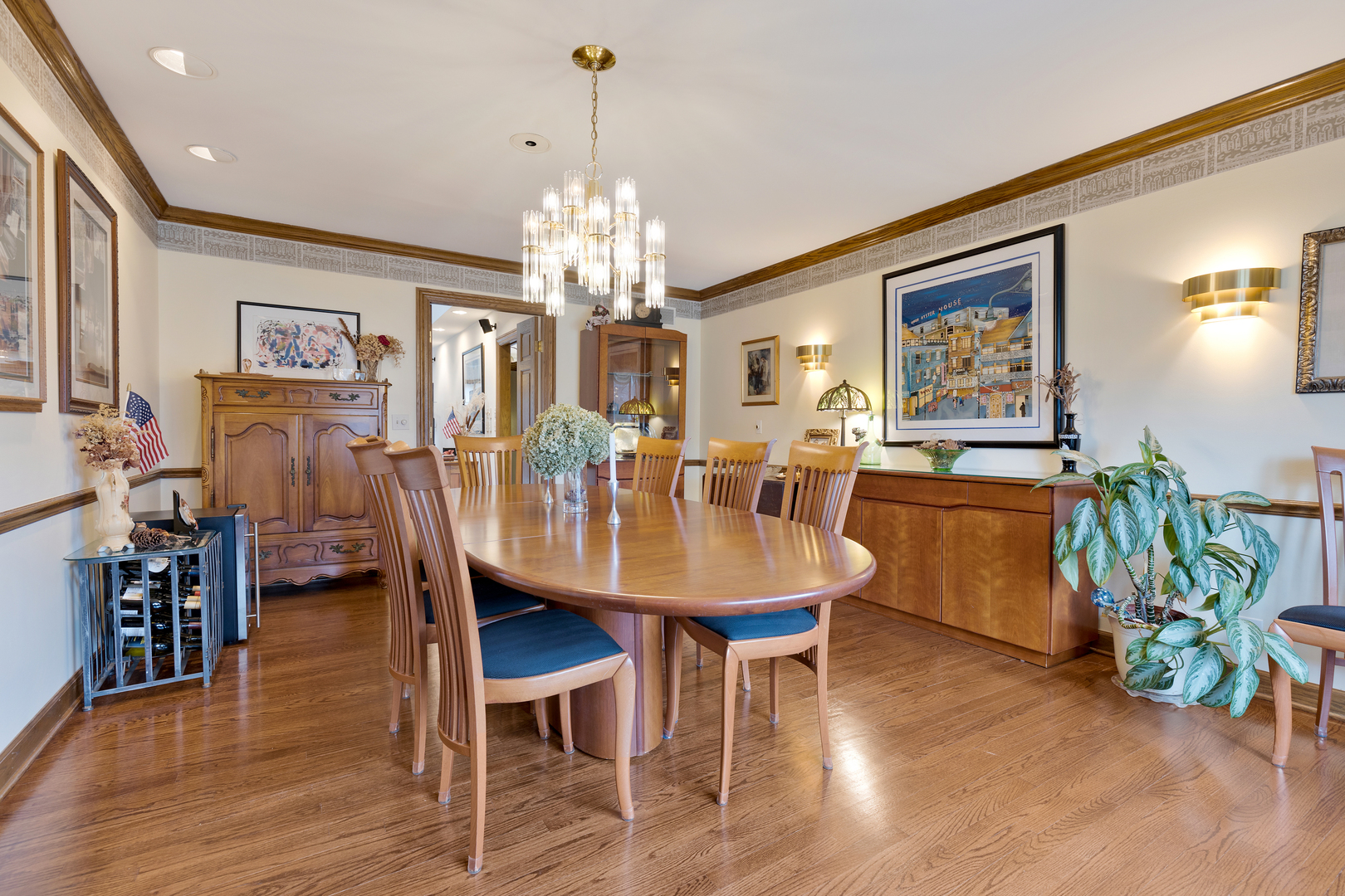 1133 Edgewater Drive Naperville, IL 60540 - Photo 8 of 37 a view of a dining room with furniture and chandelier