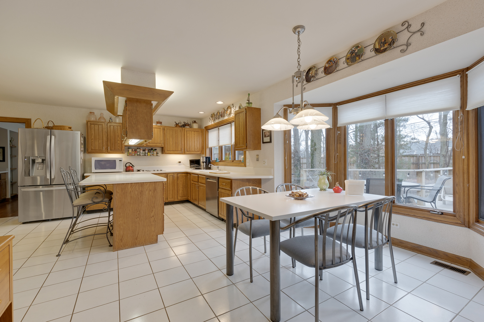 1133 Edgewater Drive Naperville, IL 60540 - Photo 9 of 37 a room with granite countertop lots of counter top space and stainless steel appliances