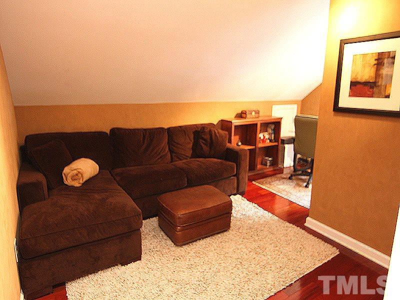 2712 Farnborough Road Raleigh, NC 27613 - Photo 20 of 25 Third floor walk-up bonus left side bonus room. Shown here used as Media/Study. Also features large walk-in closet. Beautiful Brazilian/Bolivian hardwood floors.