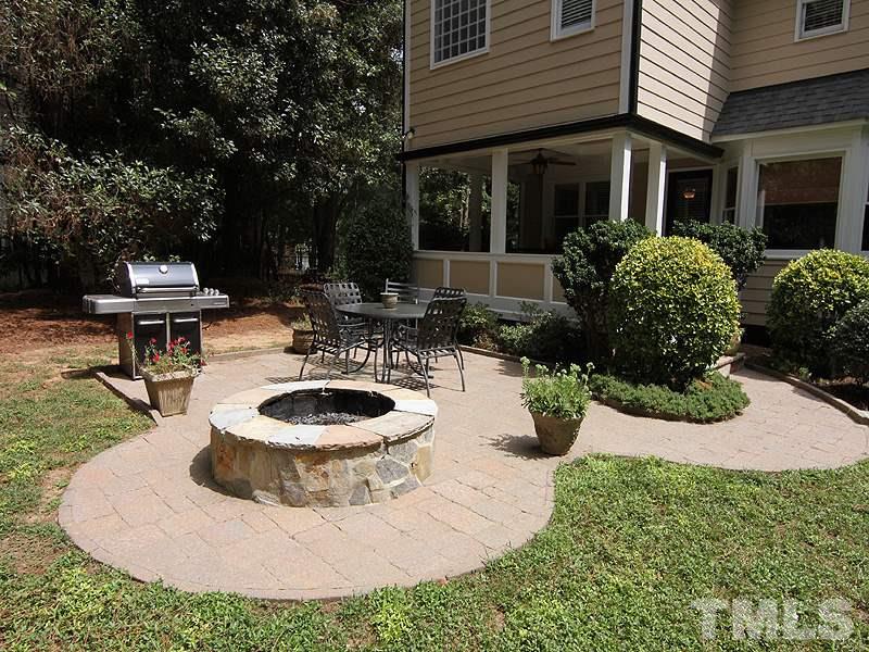 2712 Farnborough Road Raleigh, NC 27613 - Photo 22 of 25 newly added hardie board siding - Whole house exterior painted 2008 . Newly added paver patio & fire pit. Perfect for outdoor entertaining. Additional walk-in storage access on rear exterior of the home is great for lawn &sports equipment/bike storage