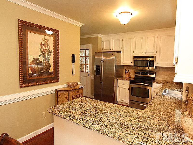2712 Farnborough Road Raleigh, NC 27613 - Photo 6 of 25 Beautiful hardwood floors in kitchen and throughout main floor