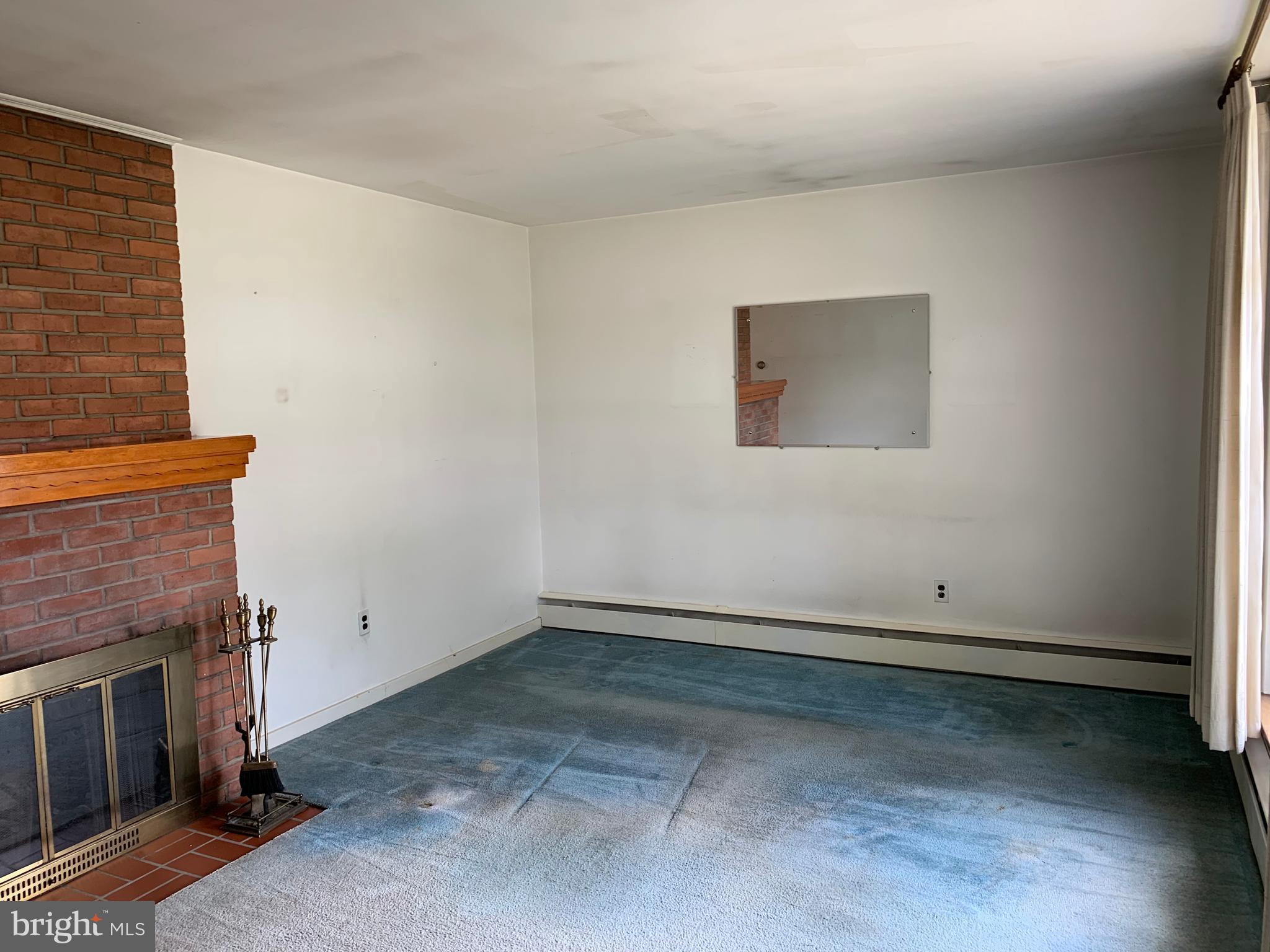 19 Quaker Hills Road Lancaster, PA 17603 - Photo 3 of 16 Living Room with Hardwood floors underneath carpet