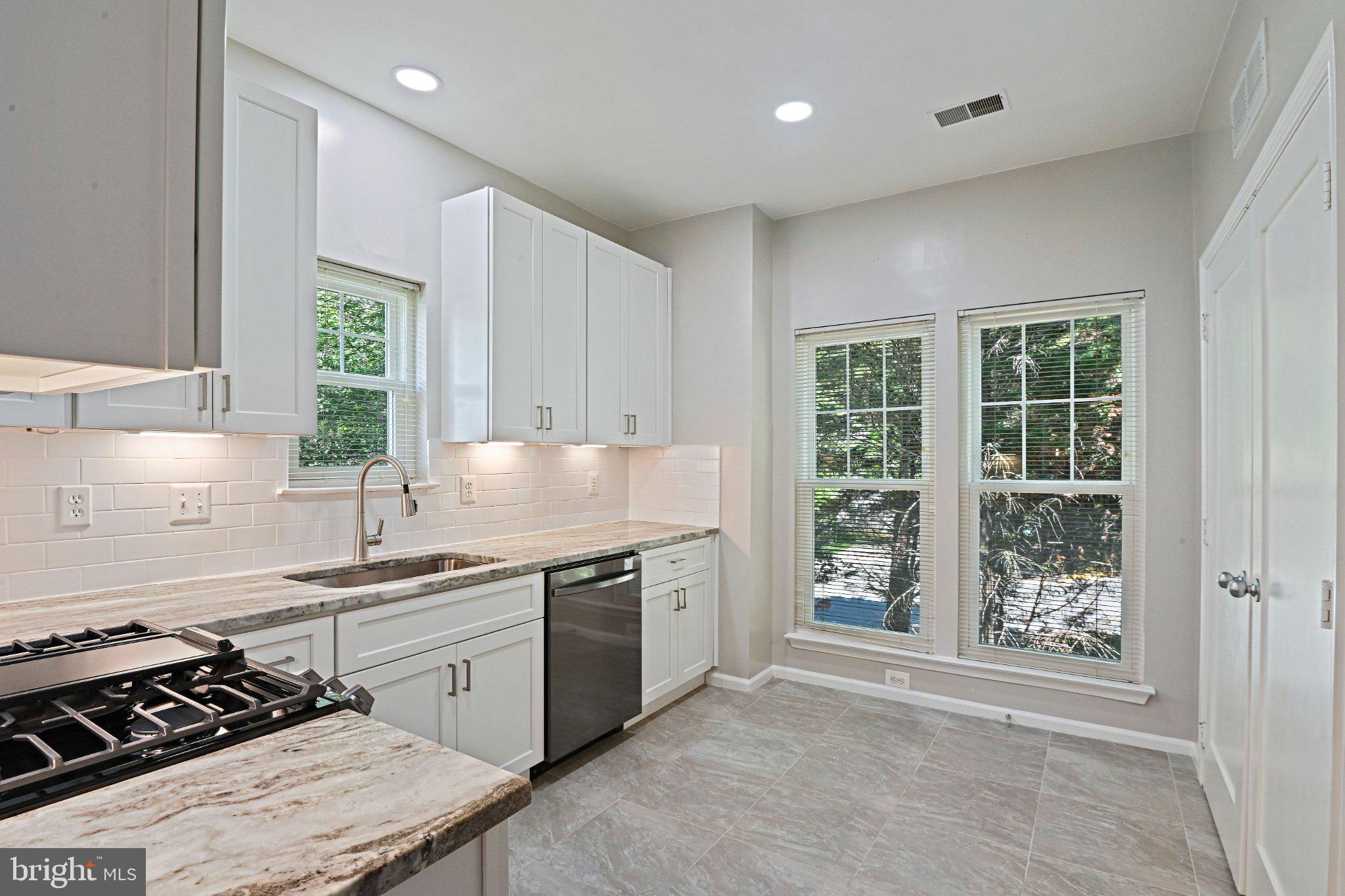 1519 North Point Drive, Unit 202 Reston, VA 20194 - Photo 16 of 49 Bright and airy kitchen oasis.