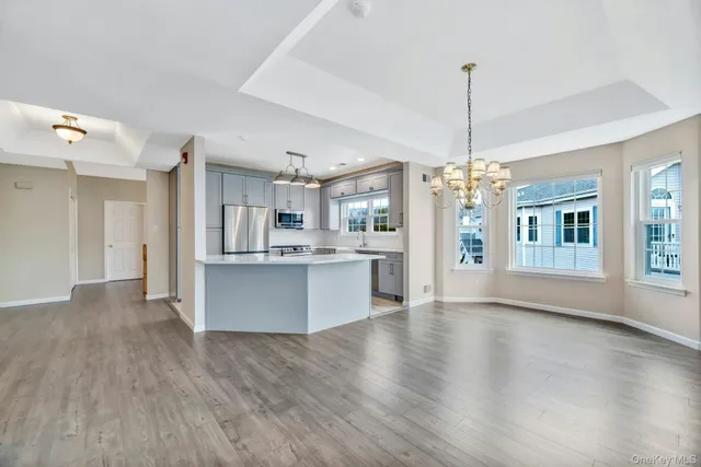 a kitchen with a stove a sink and a refrigerator