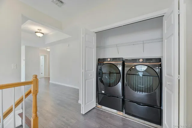 a bathroom with a granite countertop sink mirror and toilet