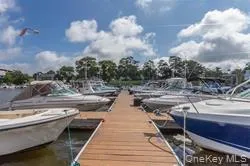 a view of residential house with outdoor space and lake view