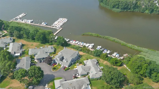 a view of a swimming pool with outdoor seating
