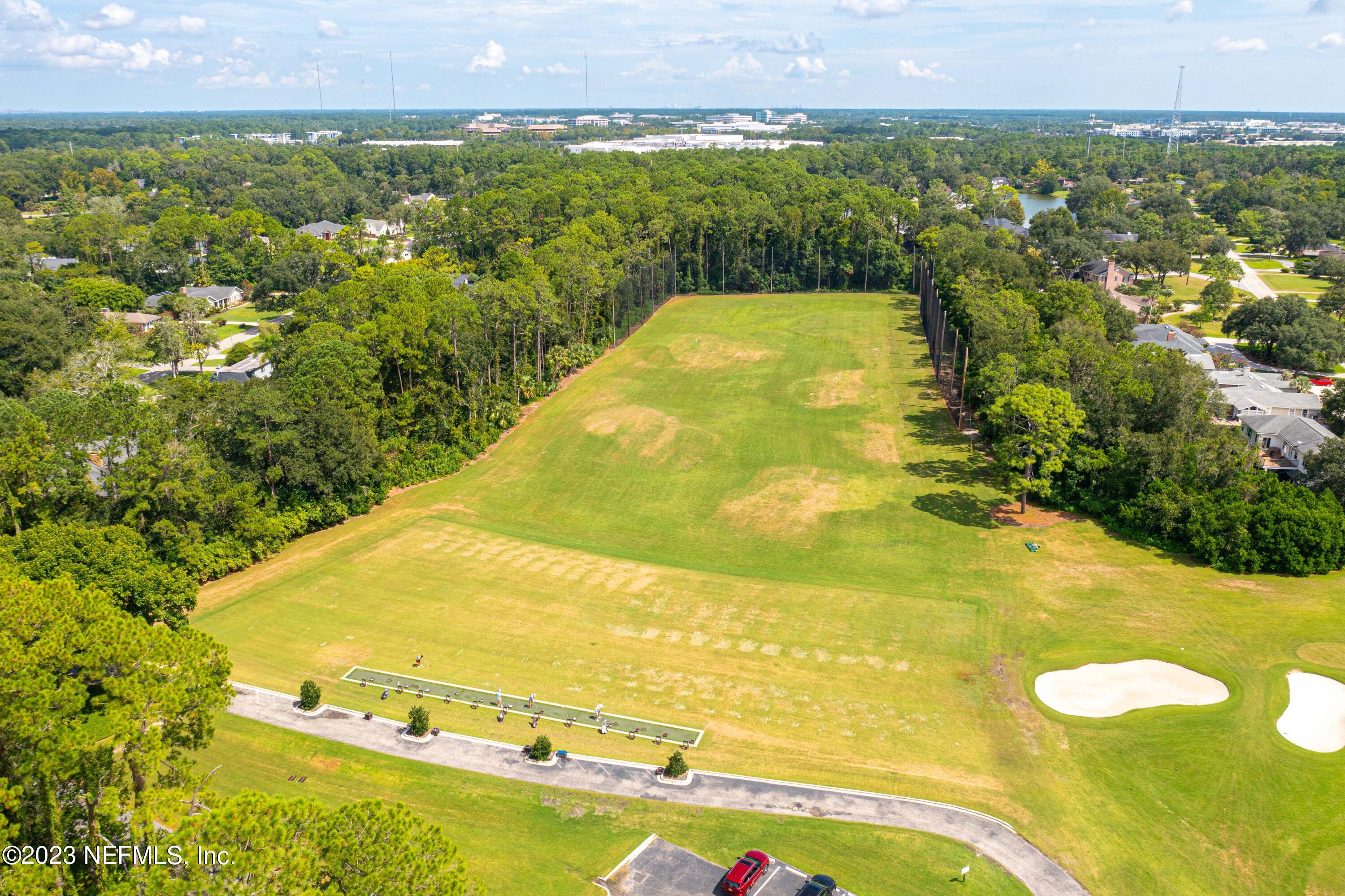 A Hollyridge Road Jacksonville, FL 32256 - Photo 18 of 28 a view of a swimming pool with a yard