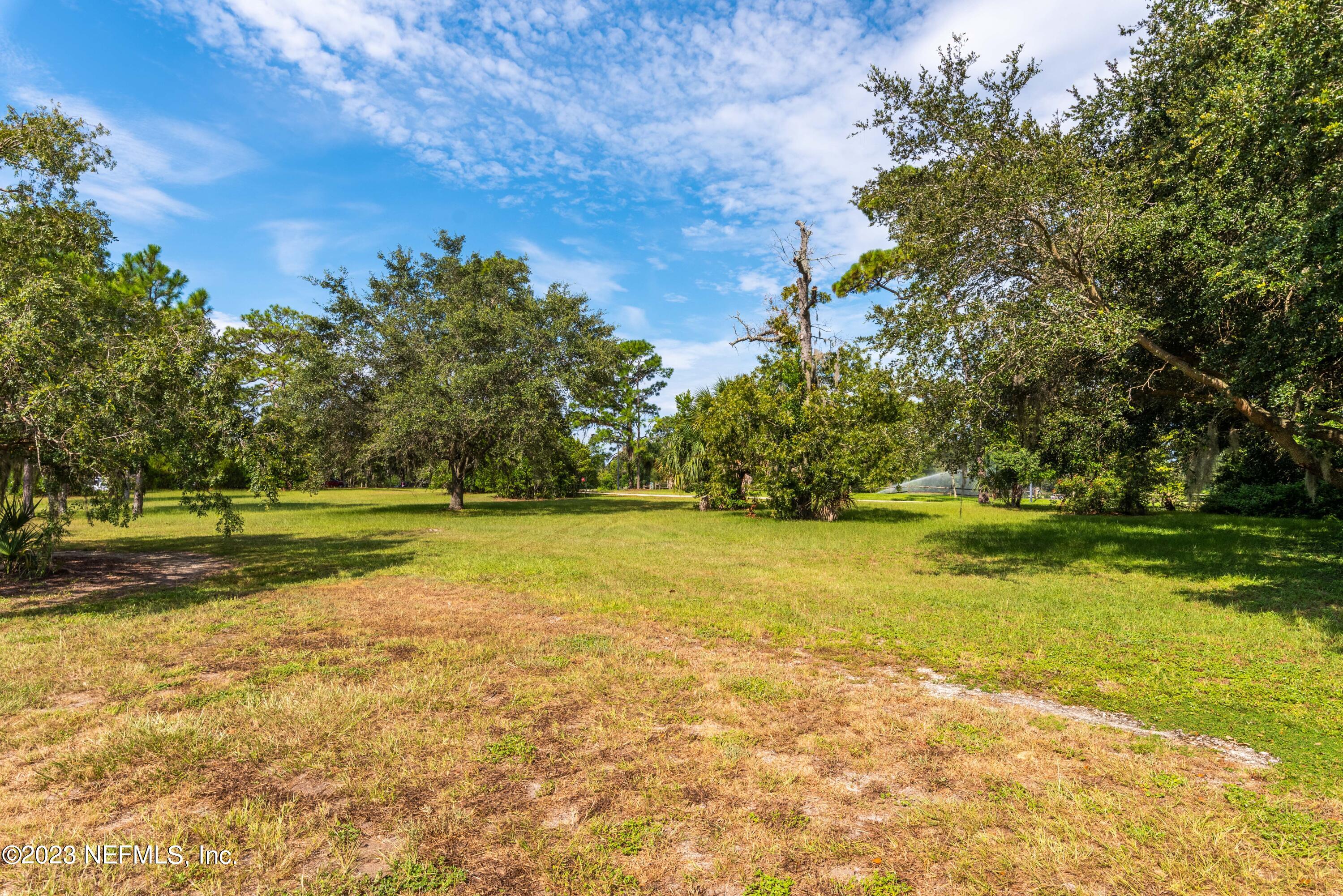 A Hollyridge Road Jacksonville, FL 32256 - Photo 5 of 28 a view of a swimming pool with an outdoor space and seating area