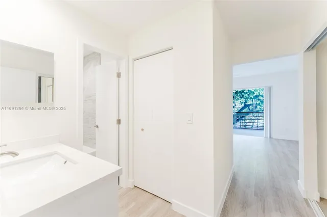 a bathroom with a tub and a sink