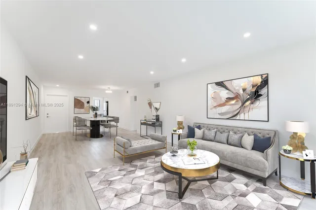 a living room with furniture and a dining table with wooden floor