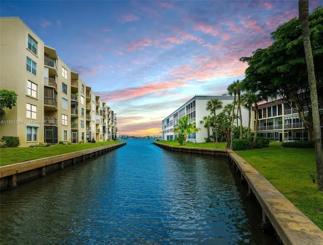 a view of residential house with outdoor space and lake view