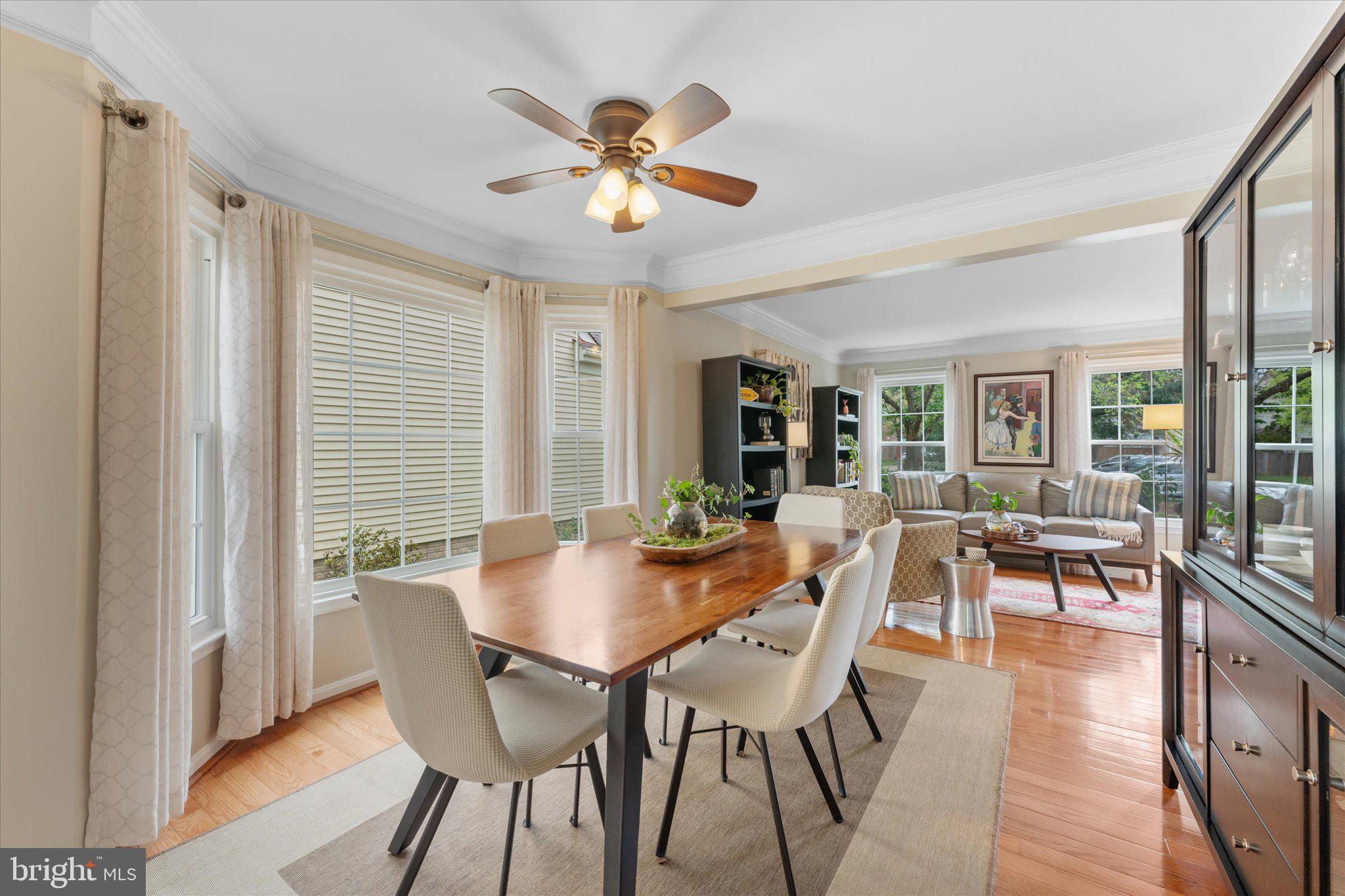 21047 Barcroft Way Sterling, VA 20164 - Photo 12 of 47 a view of a dining room with furniture window and wooden floor