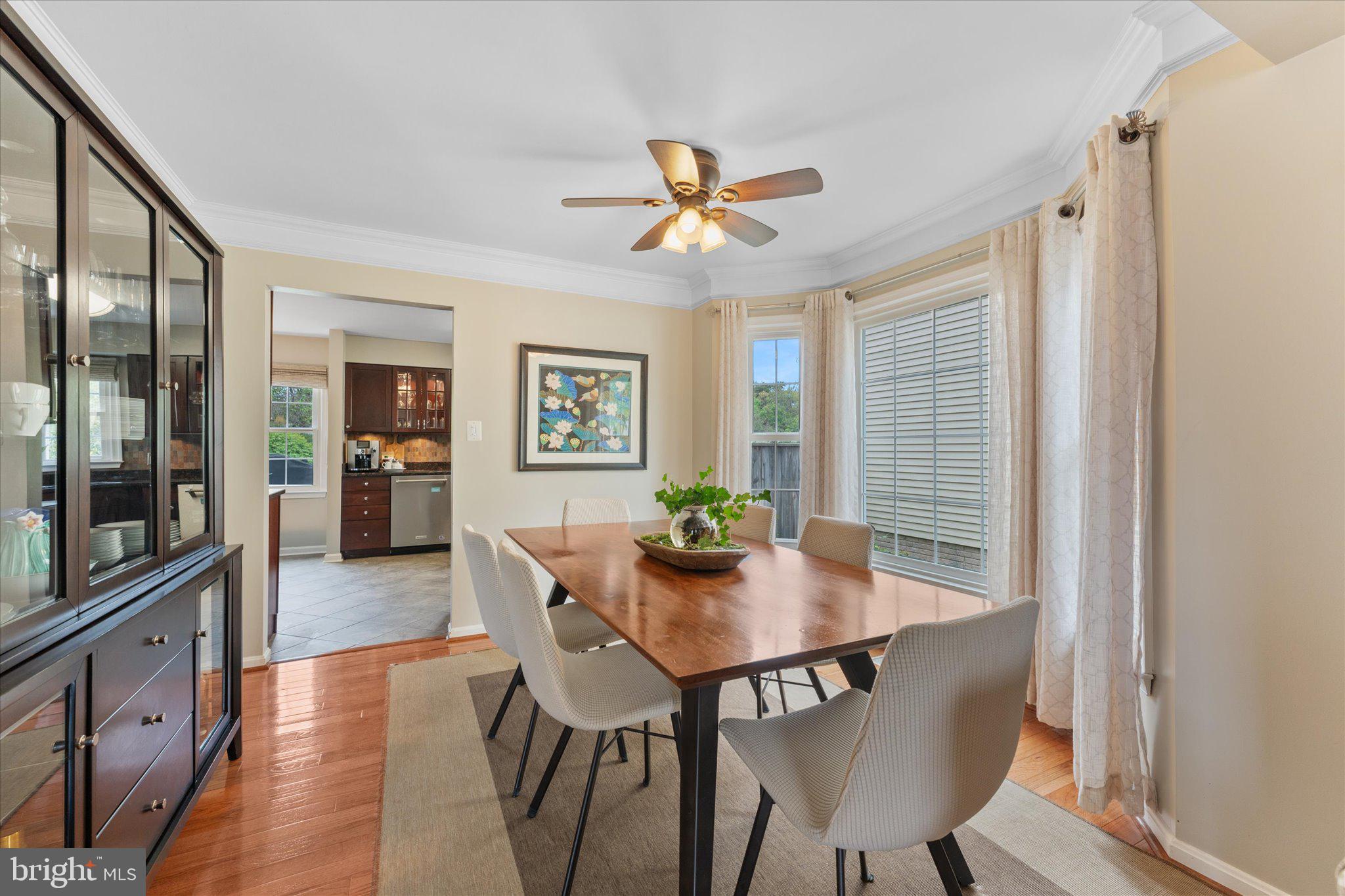 21047 Barcroft Way Sterling, VA 20164 - Photo 13 of 47 a view of a dining room with furniture window and wooden floor