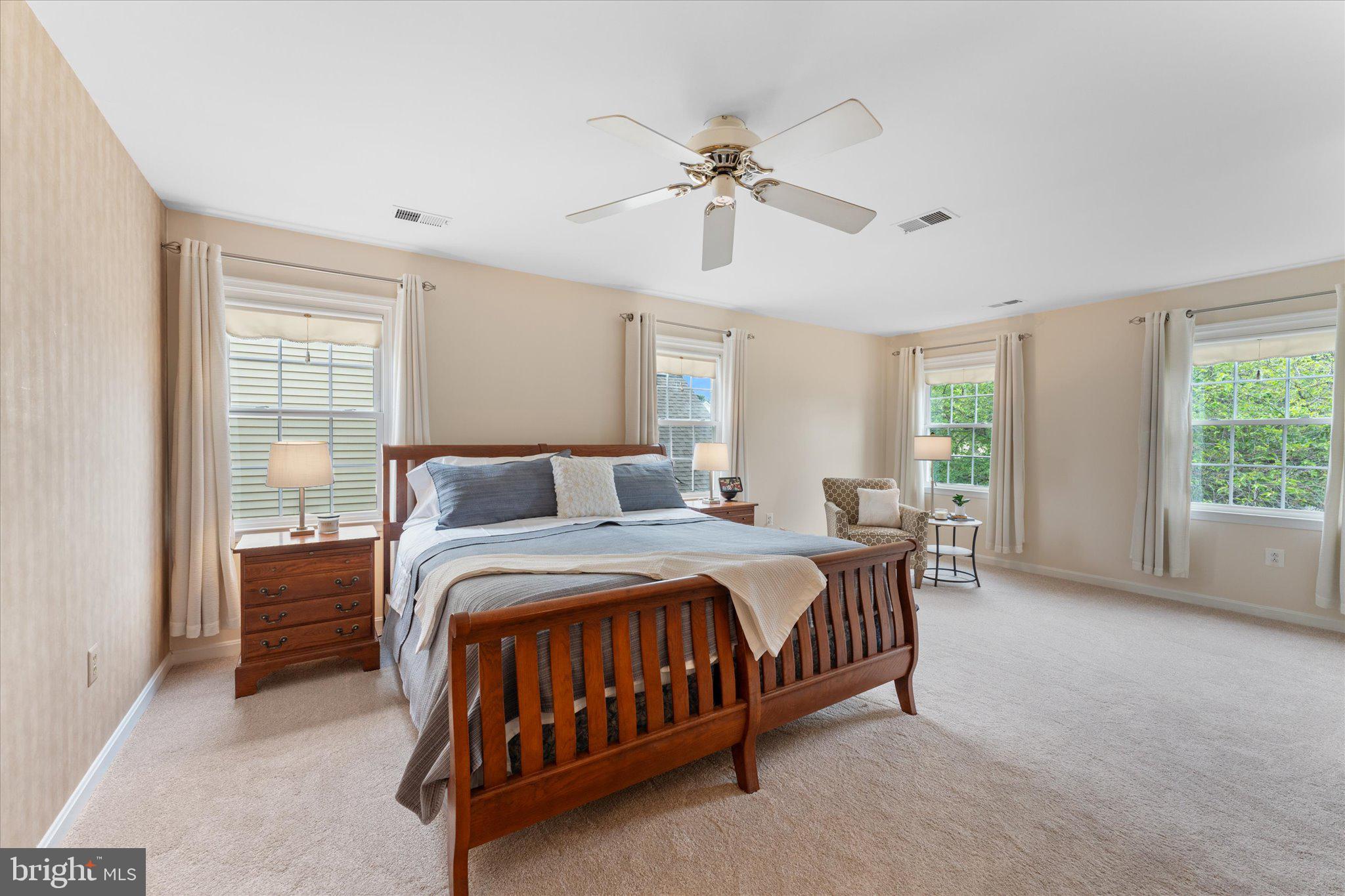 21047 Barcroft Way Sterling, VA 20164 - Photo 22 of 47 a bedroom with a bed and window