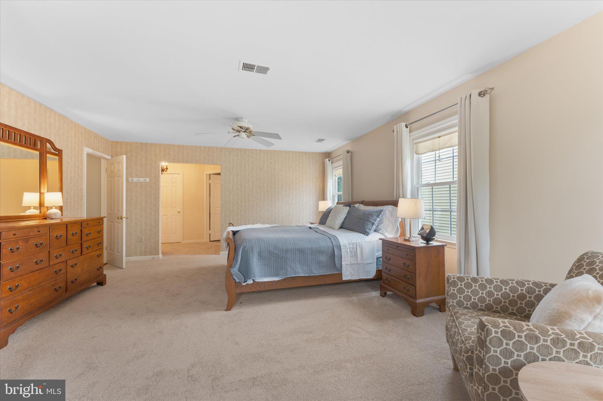 21047 Barcroft Way Sterling, VA 20164 - Photo 23 of 47 a spacious bedroom with a bed and window