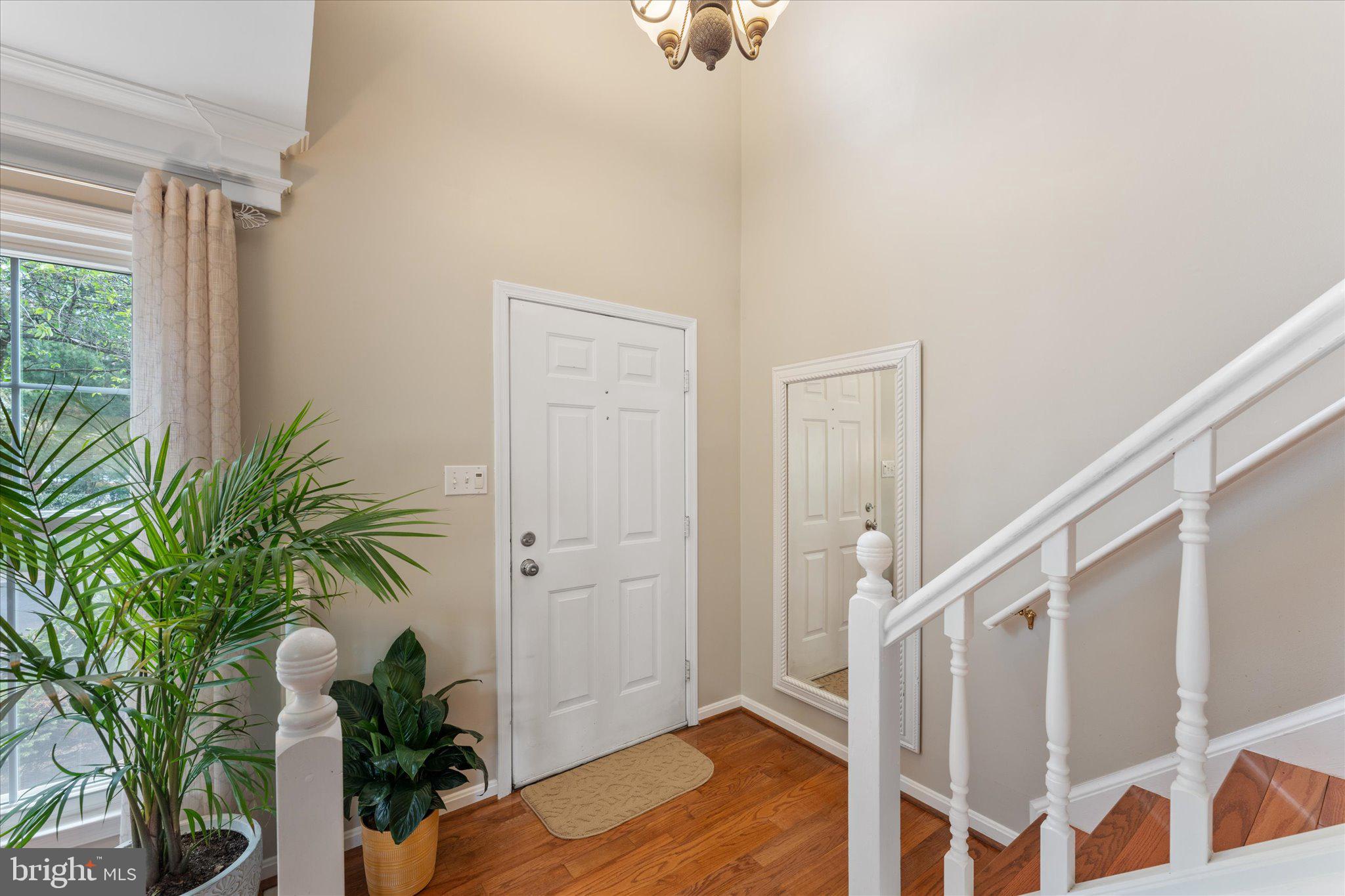 21047 Barcroft Way Sterling, VA 20164 - Photo 3 of 47 a view of front door and porch with wooden floor