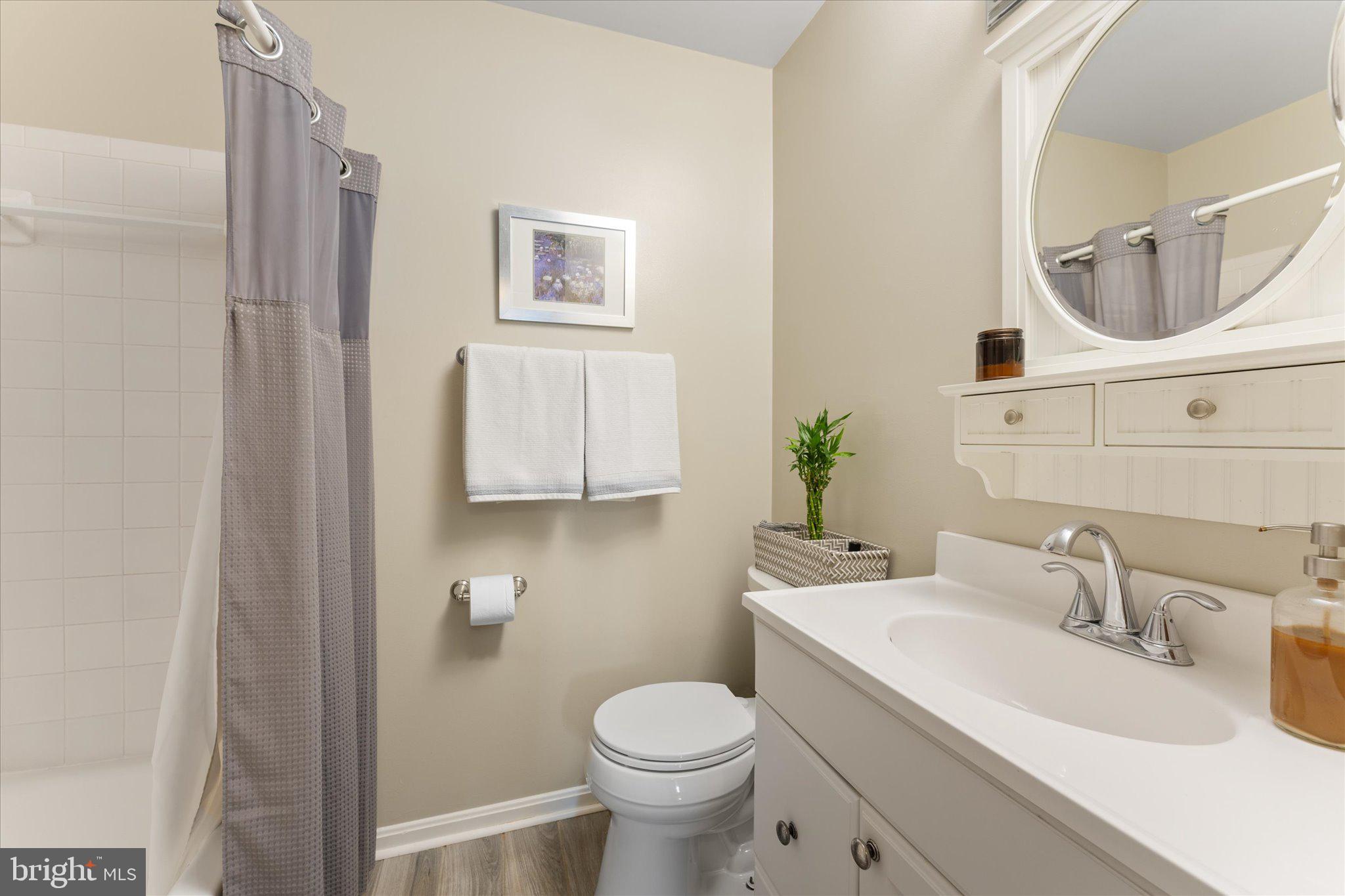 21047 Barcroft Way Sterling, VA 20164 - Photo 32 of 47 a bathroom with a toilet sink and mirror