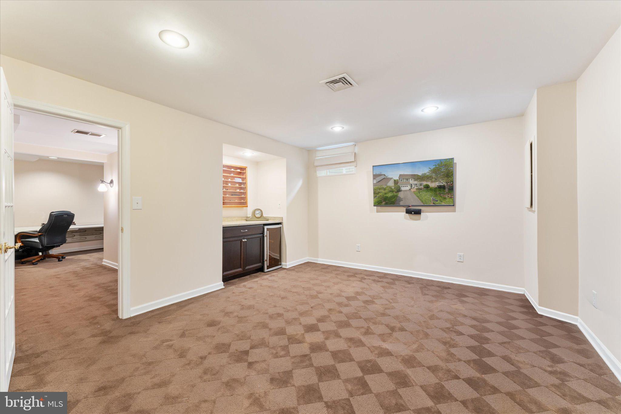 21047 Barcroft Way Sterling, VA 20164 - Photo 34 of 47 an empty room with kitchen view and a window